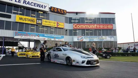 Chris McGaha's drag race car at the starting line of a raceway