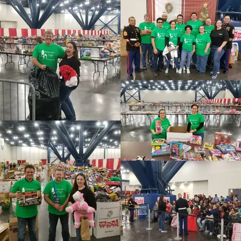 Neuralog volunteers in green shirts sorting and handing out toys at the Marine Toys for Tots distribution center